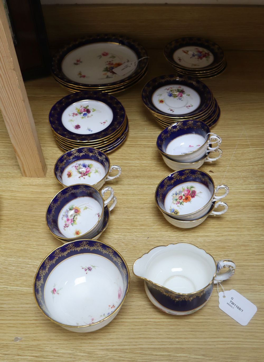 A Royal Worcester part tea service, painted with flower sprays by Ernest Phillips and Ernest Barker,